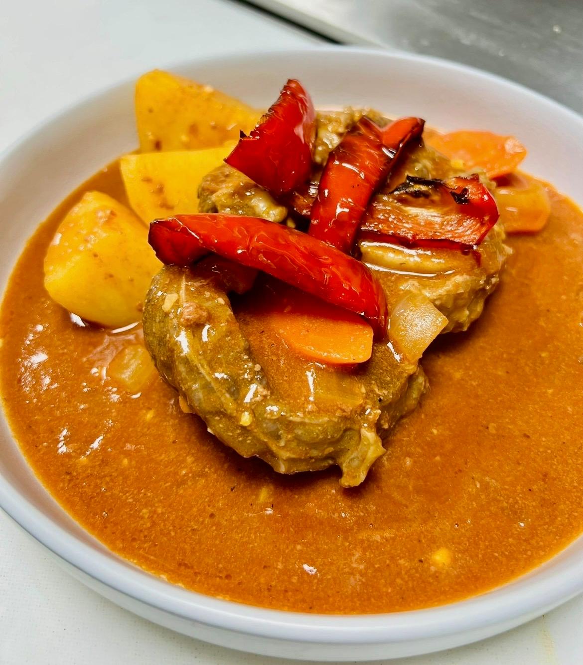 Beef stew with potatoes, carrots, and roasted red peppers